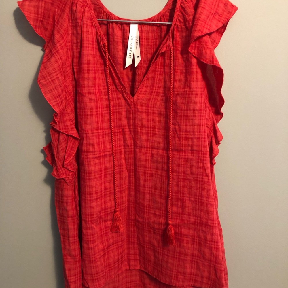 Liverpool sleeveless shirt.